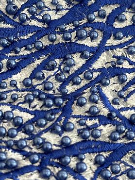 White embroidered tulle , with royal embroidery and pearls