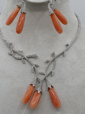 18kt white gold and diamond and coral earring and Necklace set.
